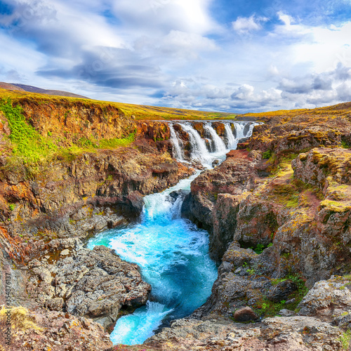 Captivating view of  Kolufossar waterfall at summer sunny day.