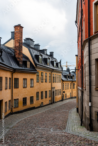 Picturesque cobblestoned street with colorful houses in Sodermalm in Stockholm photo