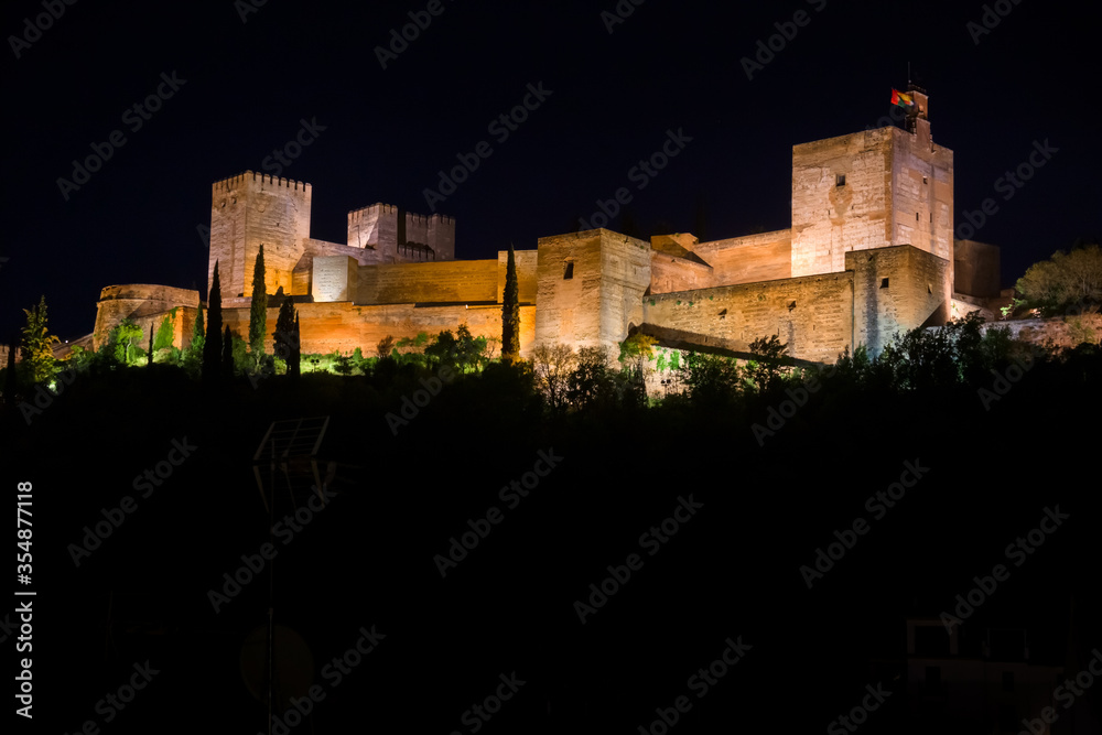 Panoramic night view of the Alhambra in the city of Granada, Spain.
