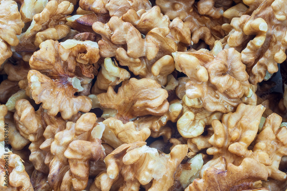 Pieces of chopped walnut as an abstract background Pieces of chopped walnut as an abstract background