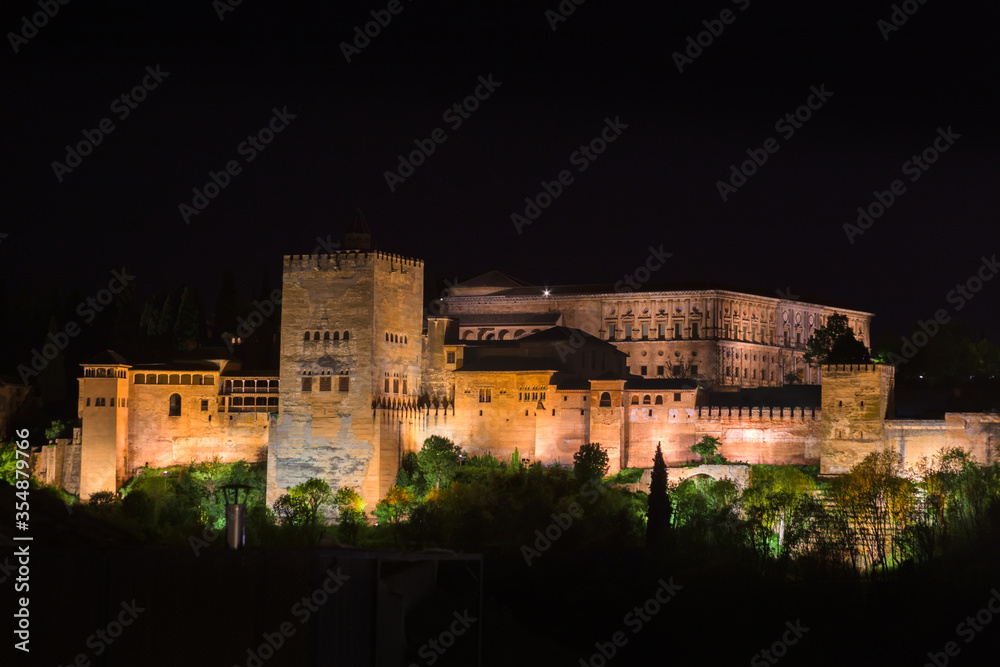 Panoramic night view of the Alhambra in the city of Granada, Spain.