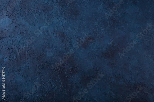 Dark navy blue stone texture background. Top view. Copy space.