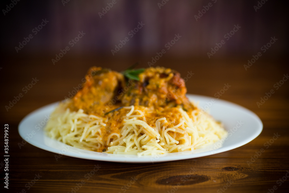 boiled vermicelli with meat and gravy in a plate boiled vermicelli with meat and gravy in a plate