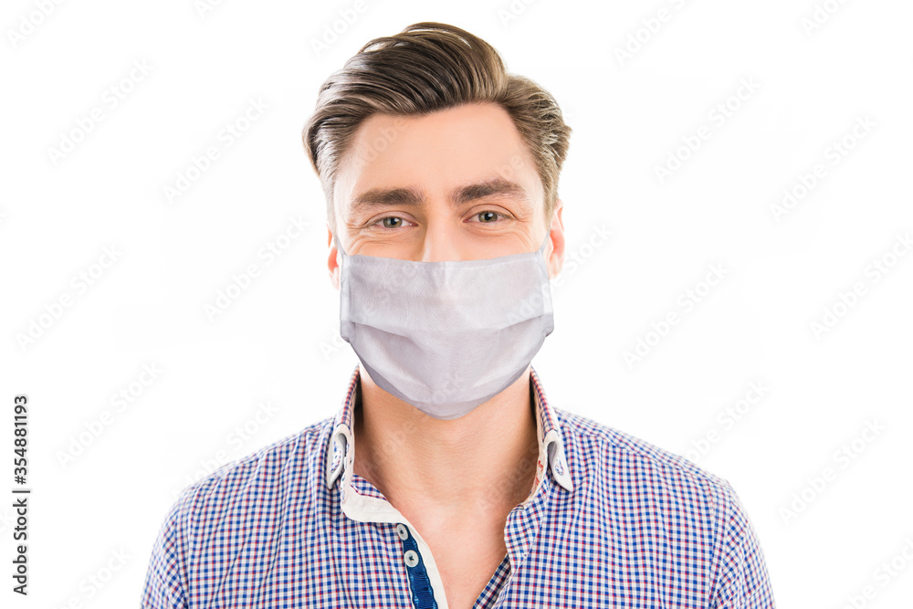 Close-up portrait of his he attractive content cheery healthy guy wearing reusable sterile mask health care medicine cov prevention isolated over white light pastel color background Close-up portrait of his he attractive content cheery healthy guy wearing reusable sterile mask health care medicine cov prevention isolated over white light pastel color background
