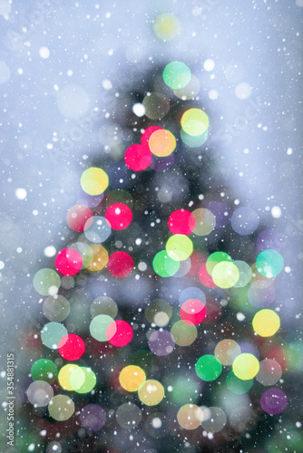 Blur Christmas tree lights decoration on purple background