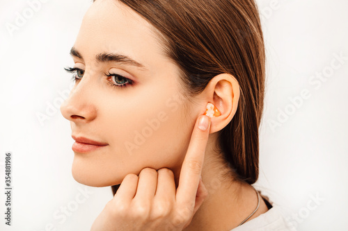 Earplugs for noisy places, personally molded earplugs on ear close-up