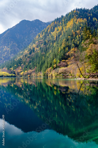 Beautiful multi-color pond at famous Jiuzhaigou National park in autumn, the world heritage site near Chengdu Chinal.