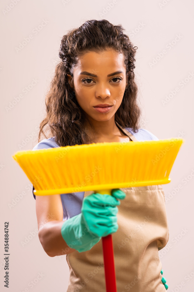 Portrait of african-american housewife who doesn't like cleaning. Portrait of african-american housewife who doesn't like cleaning.