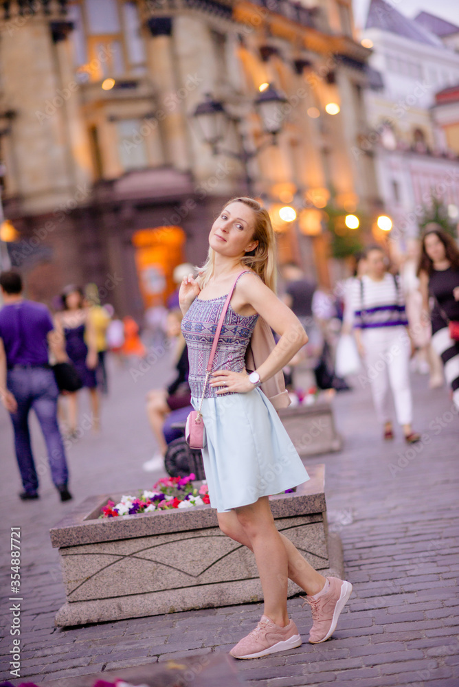 Moscow, Russia-2018 22 June. Beautiful young girl smiling on sunny street. Lifestyle Concept
