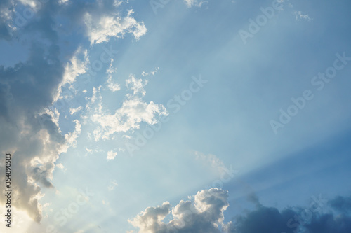 Blue sky with clouds and sun light.