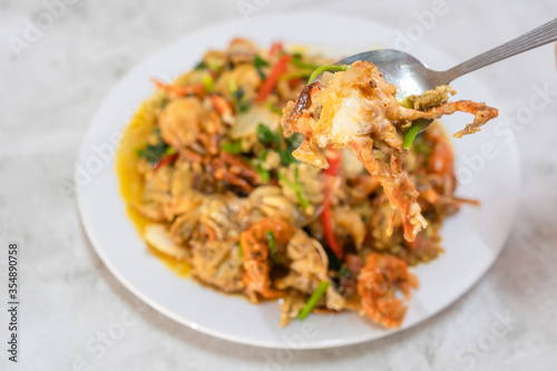 Stir Fried soft shell crab yellow curry powder ingredients it is the favorite delicious Thai, Chinese seafood of Thailand