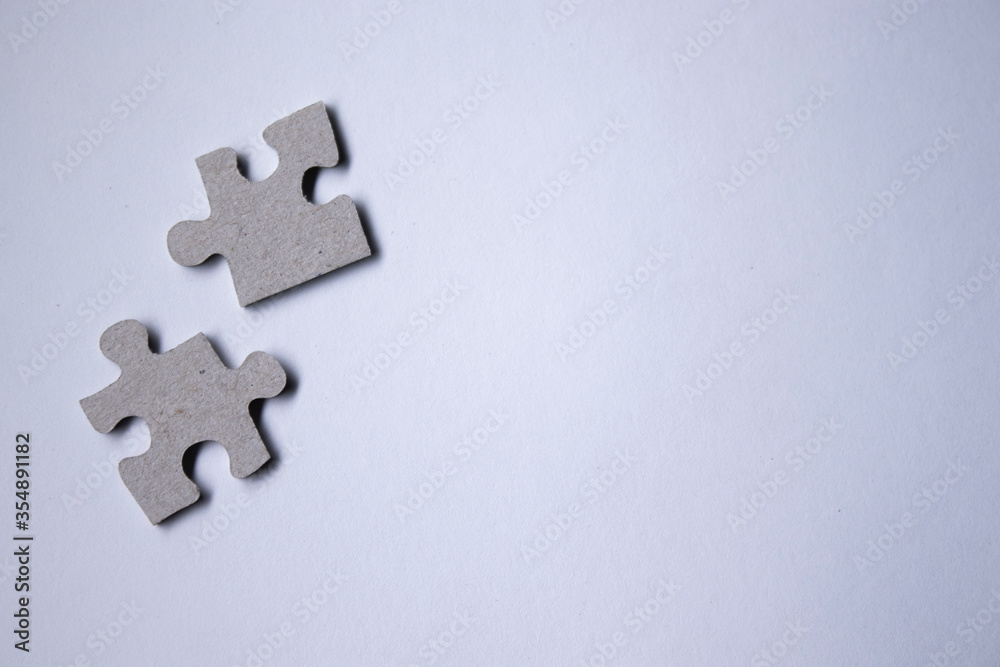 gray puzzles on a white background. isolated. Top view, copy space. . High quality photo gray puzzles on a white background. isolated. Top view, copy space. . High quality photo