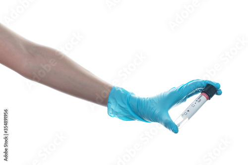 Woman hand wearing a blue rubber medical glove and hold COVID-19 swab collection kit on white isolated background.