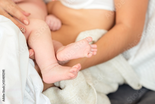 Feet of new born Baby in Hands of parents
