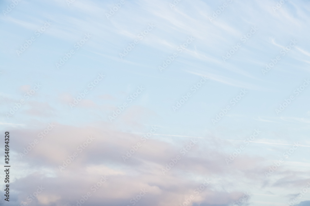 Background of sky with clouds. Blue sky with clouds background with soft focus. Spring backgorund. Empty sky background for your design.