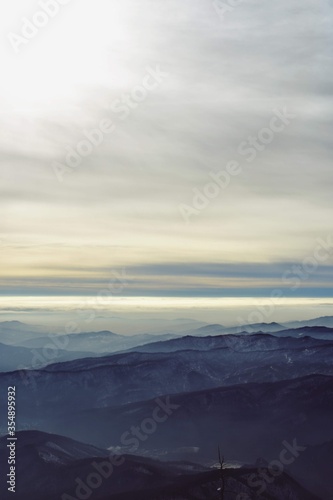 snowy mountain with beautiful clouds at high altitude  © badescu
