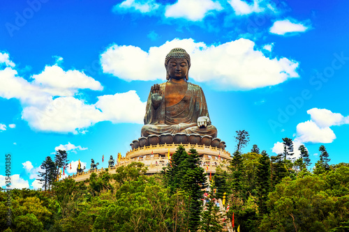 The big Tian Tan Buddha at Po Lin Monastery in Hong Kong during summer sunny day.