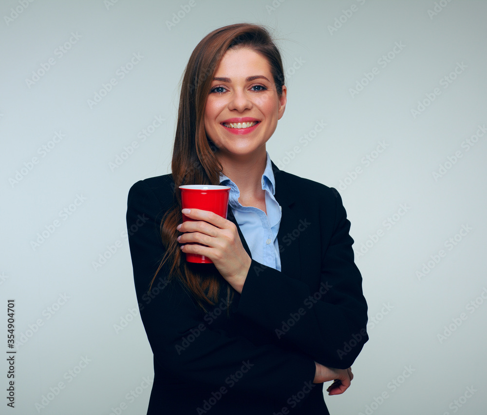 Smiling businesswoman in black suit holding red glass Smiling businesswoman in black suit holding red glass