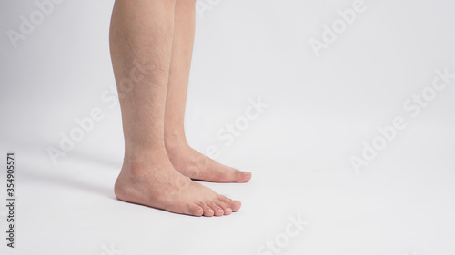 Asian Male barefoot is isolated on white background. © nisara