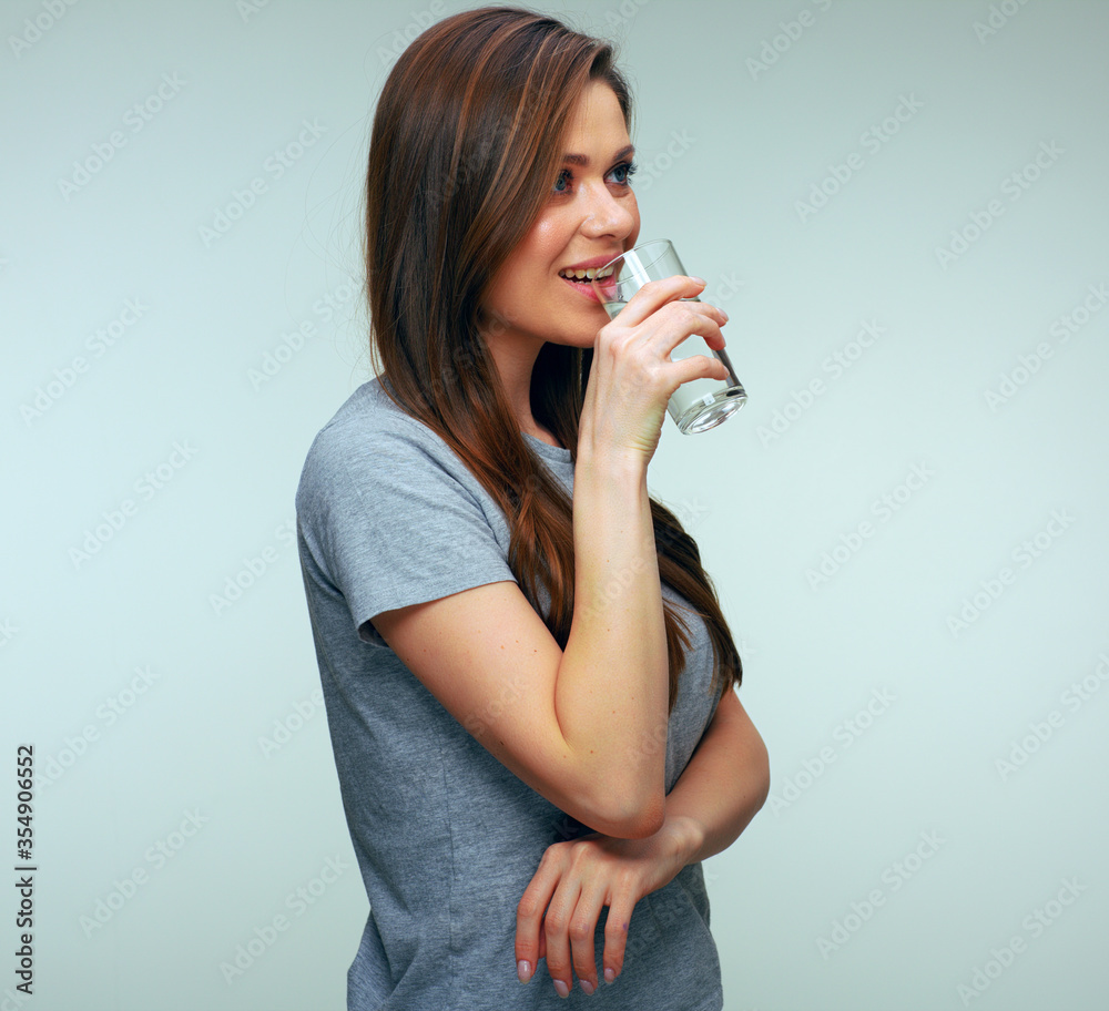 Woman drinking water from glass. Woman drinking water from glass.