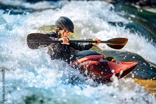 Banner whitewater kayaking, extreme sport rafting. Guy in kayak sails mountain river photo