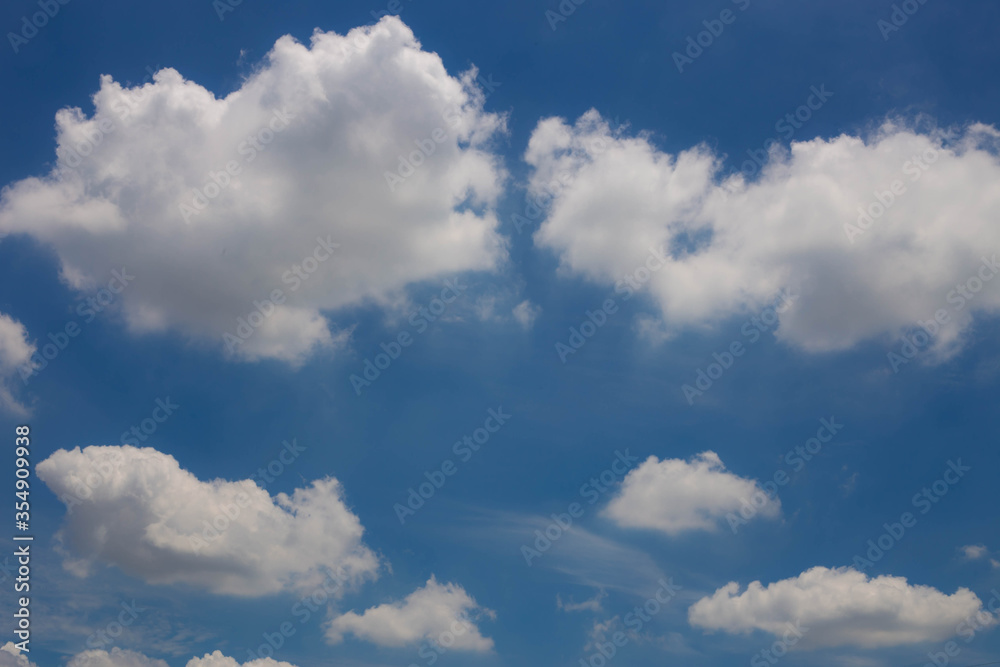 Blue skies with heavy amount of white fluffy clouds. Blue skies with heavy amount of white fluffy clouds.