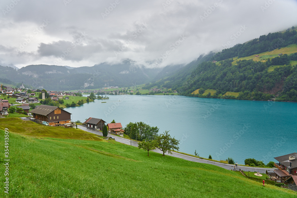 Fototapeta premium Landscape panorama with green nature in Lungern / Lungernsee lake, Swiss Alps, canton of Obwalden, Switzerland