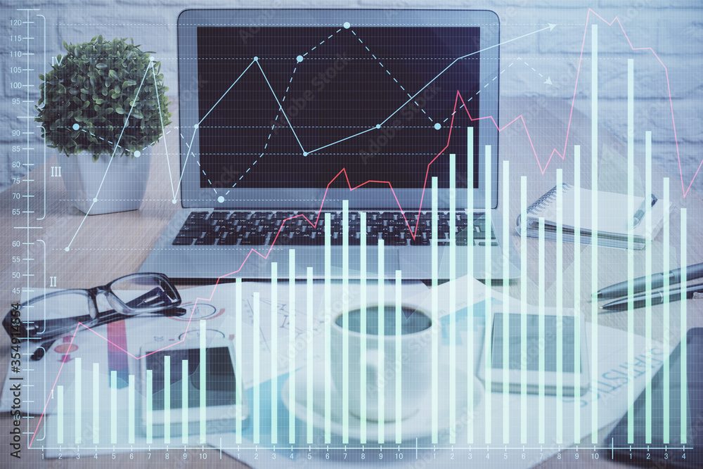 Forex market graph hologram and personal computer on background. Multi exposure. Concept of investment. Forex market graph hologram and personal computer on background. Multi exposure. Concept of investment.