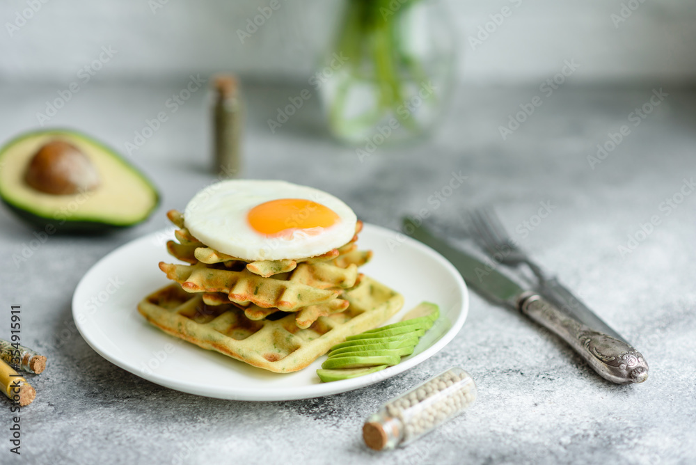 Fresh delicious and nutritious breakfast with waffles with spinach Fresh delicious and nutritious breakfast with waffles with spinach