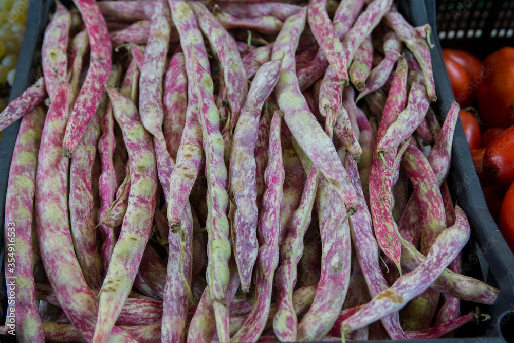 Pile of fresh purple Cranberry bean (Phaseolus vulgaris) for sale in a market, Venice Italy