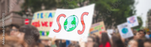 Blurred people holding picket signs  