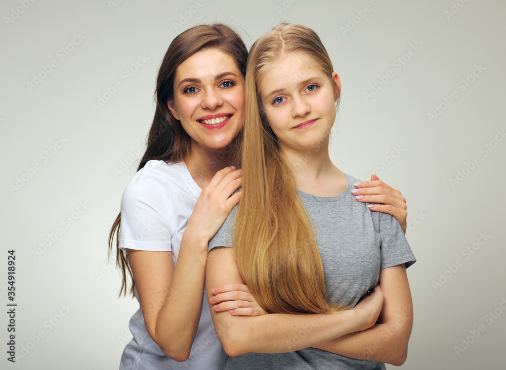Smiling mother and teen daughter. Smiling mother and teen daughter.