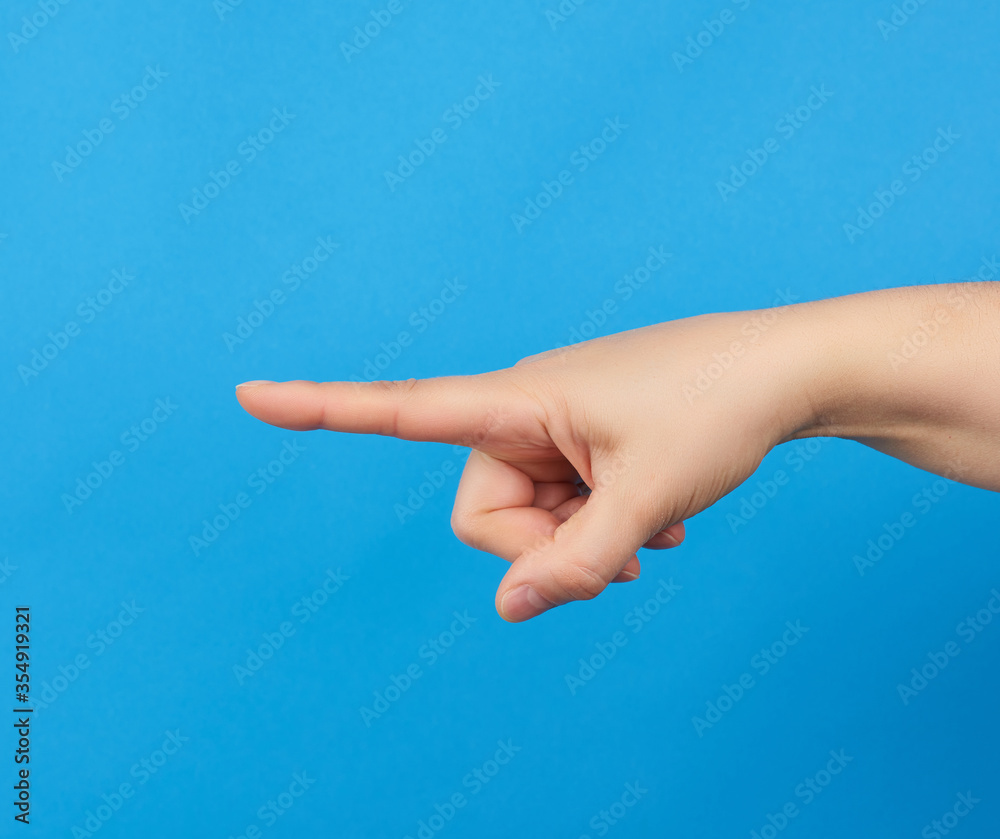 female hand holds pointing with index finger female hand holds pointing with index finger