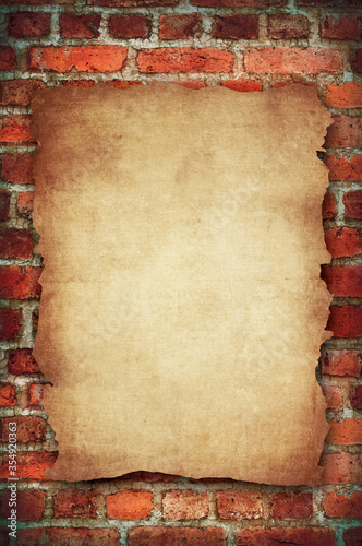 old paper on brick background