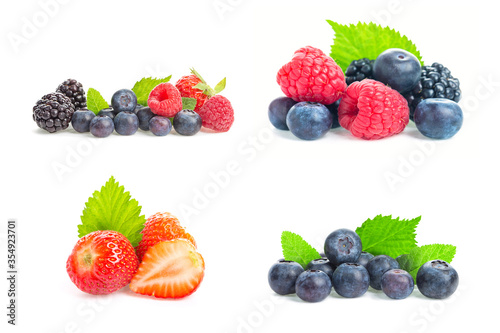 Healthy fresh food. Different berries collage set. Macro shots of fresh raspberries, blueberries, blackberries, strawberries, red currant and blackberries with leaves isolated on white background.