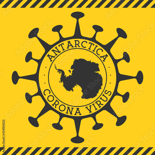 Coronavirus in Antarctica sign. Round badge with shape of virus and Antarctica map. Yellow country epidemy lockdown stamp. Vector illustration.
