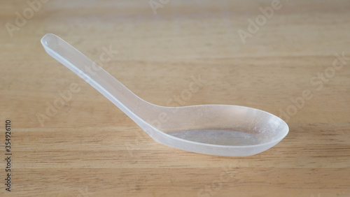 plastic spoon on a table background.