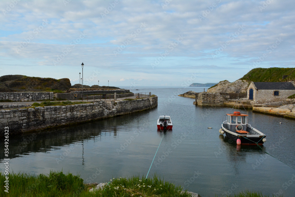 Ballintoy Harbour  in County Antrim, Northern Ireland. Fishing boats in the harbour.