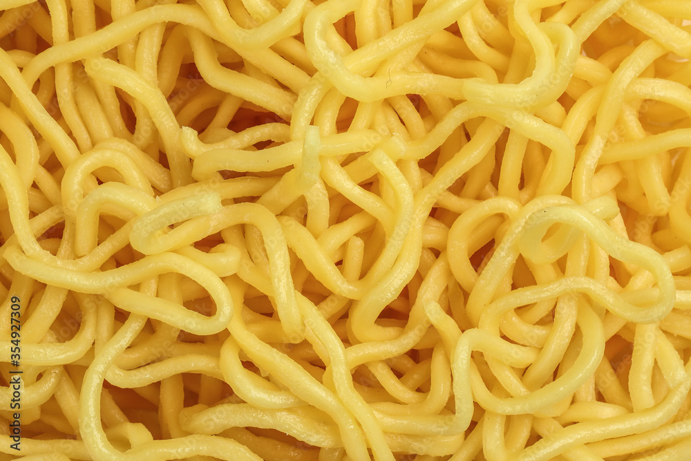 Fresh yellow egg noodle on whit background