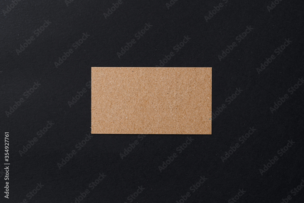 Business card of a craft paper on black background Business card of a craft paper on black background