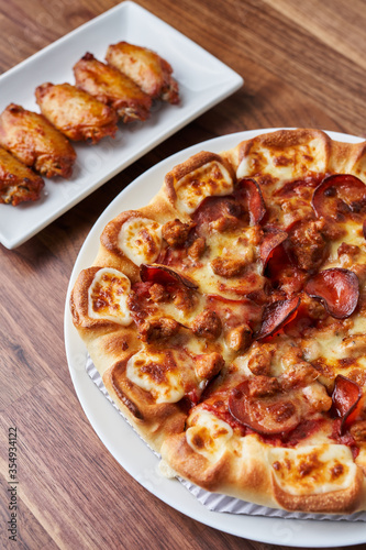 Double Pepperoni Pizza with Italian Sausage and Barbecue Chicken Wings