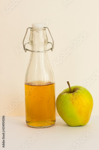 Apple juice with an Apple on a white background