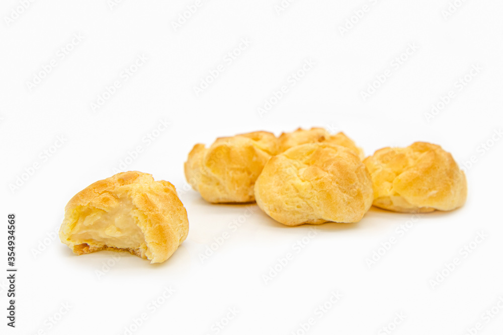 Eclairs on white background. eclairs with cream. Eclairs on white background. eclairs with cream.