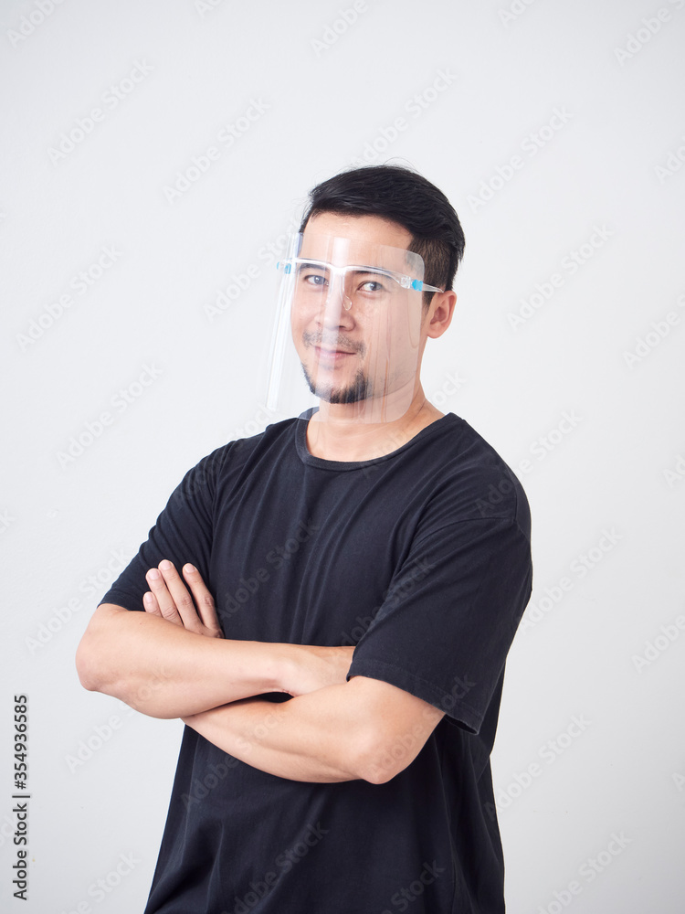 Young man in face shield.