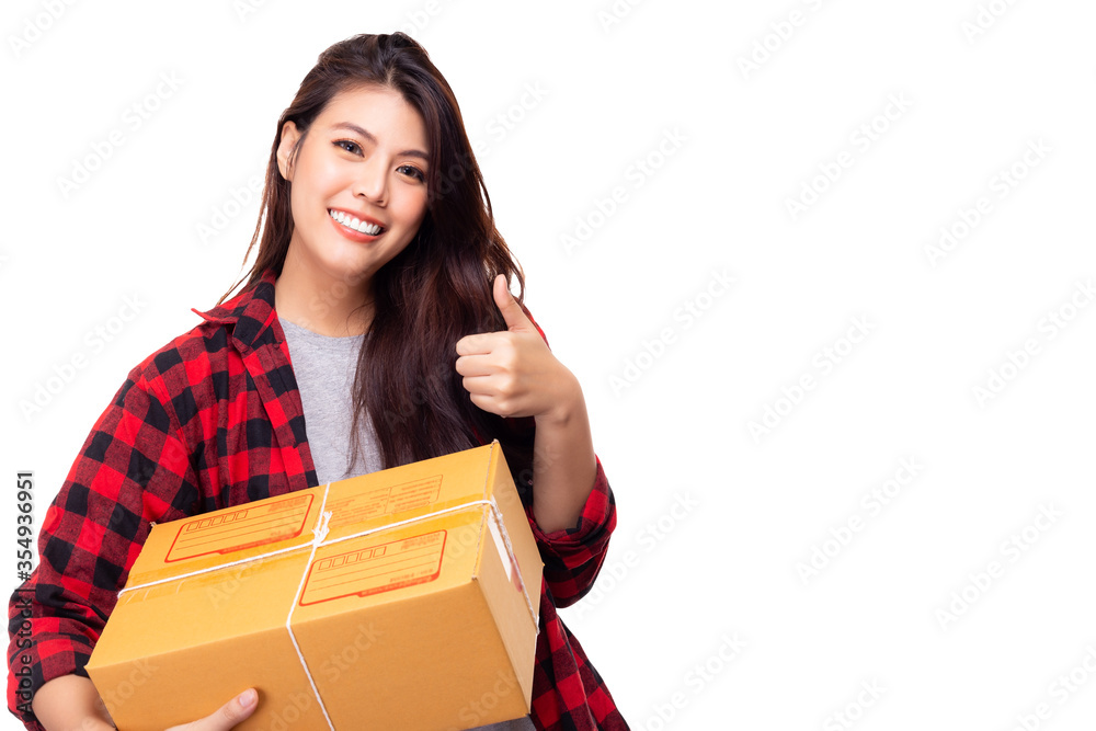 Young woman receive cardboard box or parcel box and giving thumb up that Asian girl get satisfied delivery service. online shopping, package, post, delivery concept. isolated on white. copy space Young woman receive cardboard box or parcel box and giving thumb up that Asian girl get satisfied delivery service. online shopping, package, post, delivery concept. isolated on white. copy space