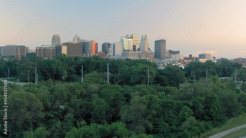 Aerial flying to downtown Kansas City at sunset. Missouri, USA