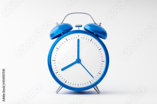 Blue alarm clock isolated on white background with retro style. Analog clock and blank face for design. 3D rendering.