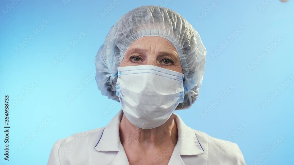 Portrait of physician in surgical mask Portrait of physician in surgical mask