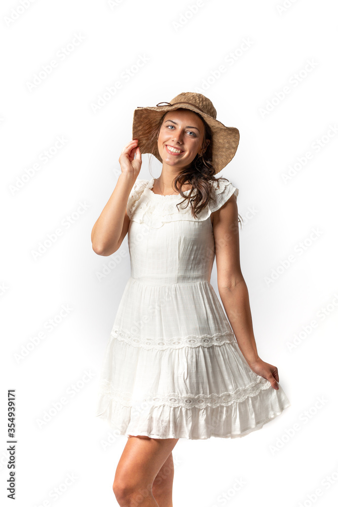 Beautiful Young Model posing in dress and hat on white background
Beautiful Young Model posing in dress and hat on white background