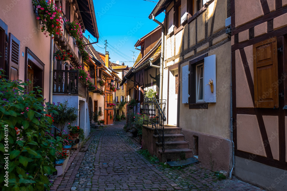 Fototapeta premium Eguisheim, colors in the houses and flowers in the windows